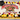 University of Maryland graduation sheet cake with red, yellow, black and ivory piping, a graduation cap and diploma.