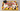 University of Maryland graduation sheet cake with red, yellow, black and ivory piping, a graduation cap and diploma.