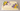 Ivory sheet cake decorated with yellow buttercream sunflowers, purple blossoms and green leaves.
